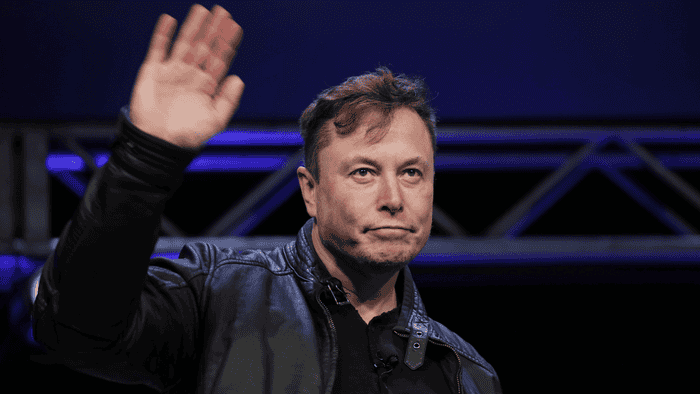 Elon Musk waves