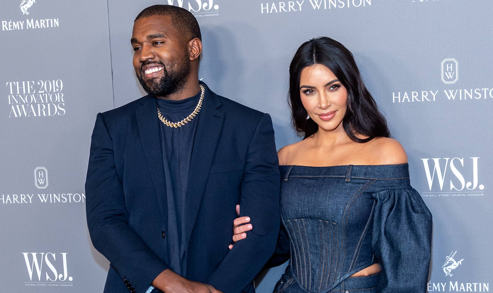 Kanye West and Kim Kardashian on a red carpet