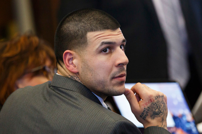 Aaron Hernandez sits at the defense table