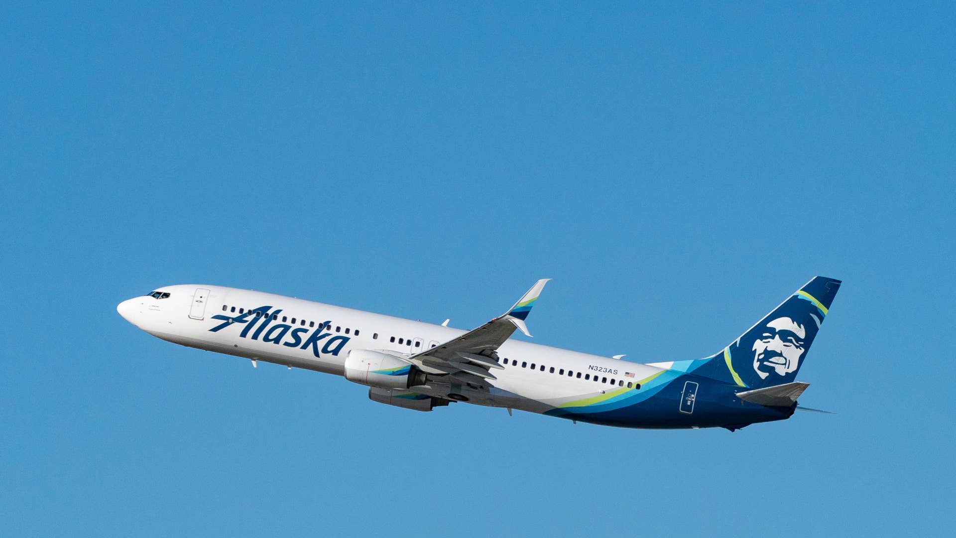 alaska airlines plane is seen in air