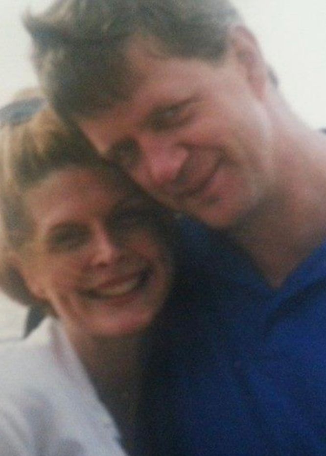 I don't know who these people are. A man in a polo shirt and a woman smiling, both with their heads touching in an affectionate pose