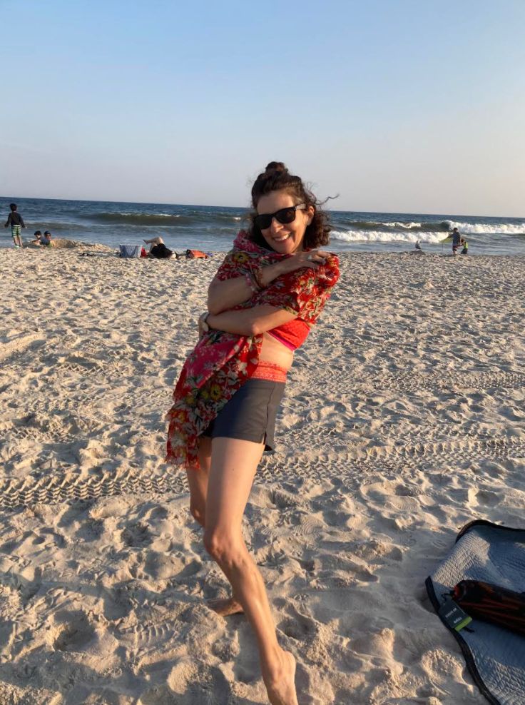 The author posing happily on the beach