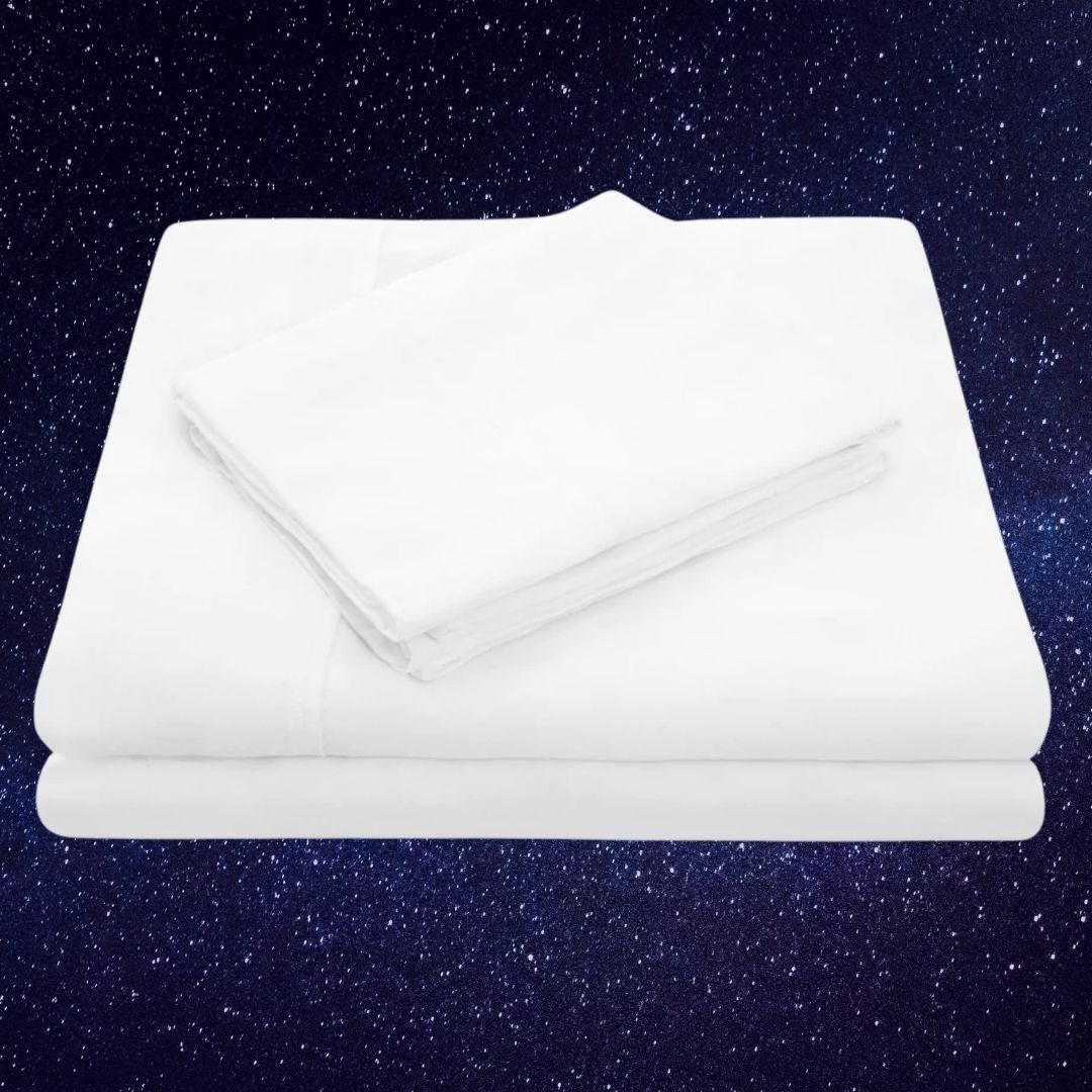 Stack of neatly folded white bed sheets against a starry night background