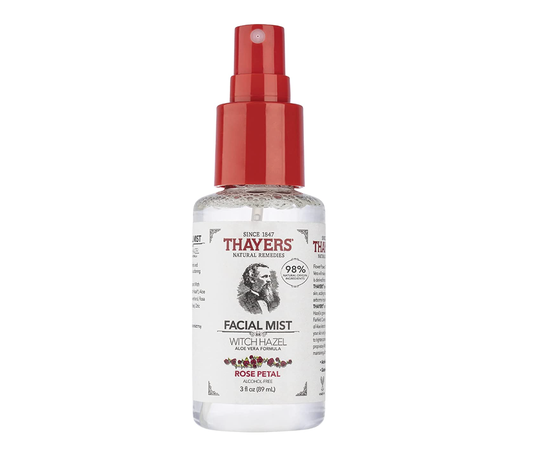 Thayers Witch Hazel Facial Mist bottle with a red spray top, featuring rose petal and aloe vera. Product is advertised as natural and soothing