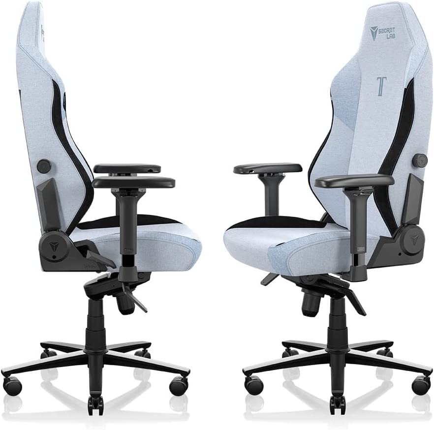 Two white gaming chairs with adjustable armrests and lumbar support, positioned front and side
