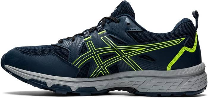 Side view of a single Asics running shoe with contrasting logo and laces