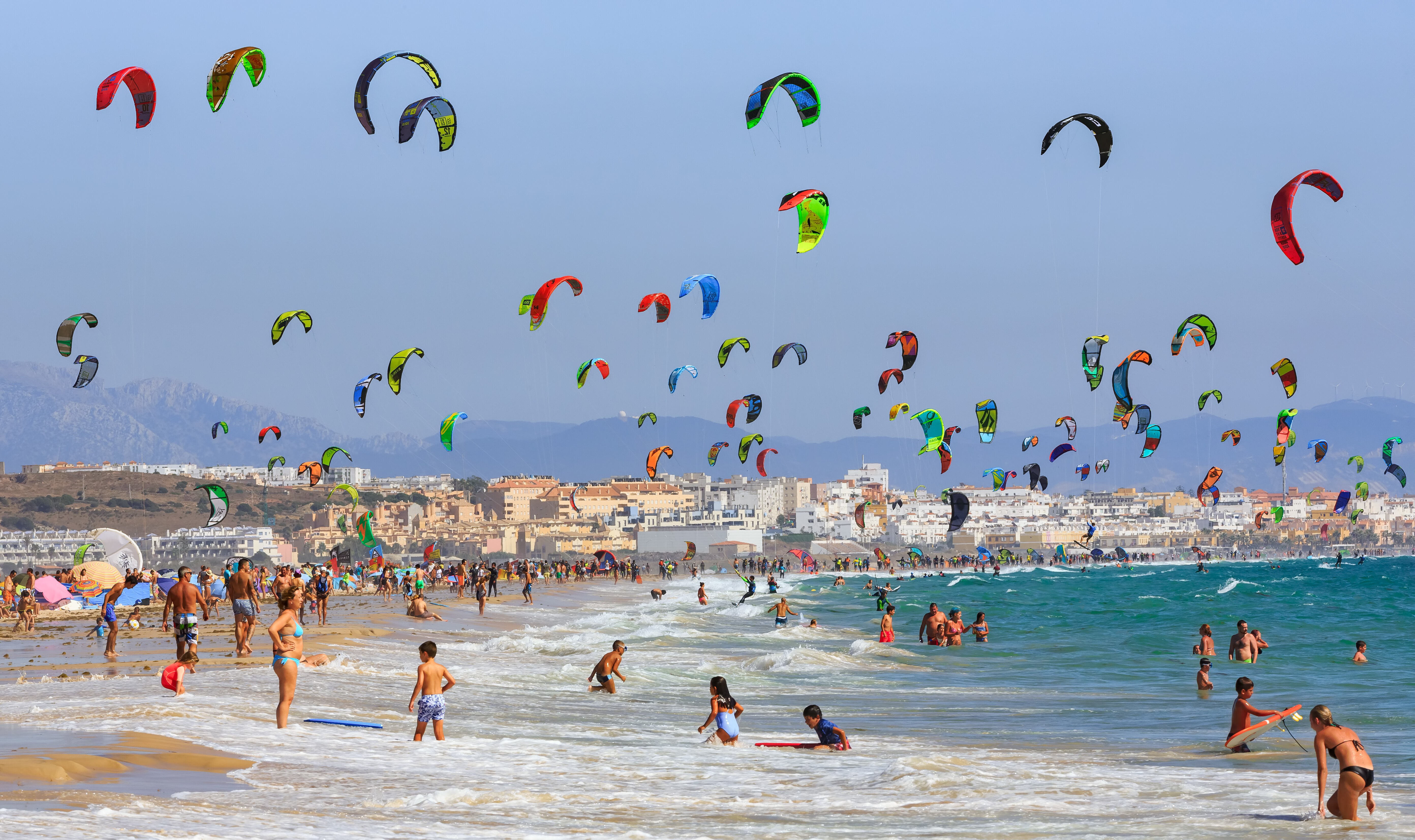 A sky dotted with kites in Tarifa, Spain