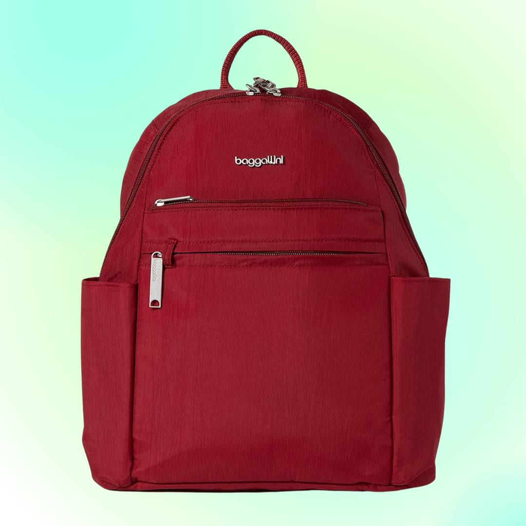 Red backpack with a sleek design, featuring aggregate  zippered pockets and a apical  handle. Perfect for mundane  usage  oregon  travel. Brand sanction  visible