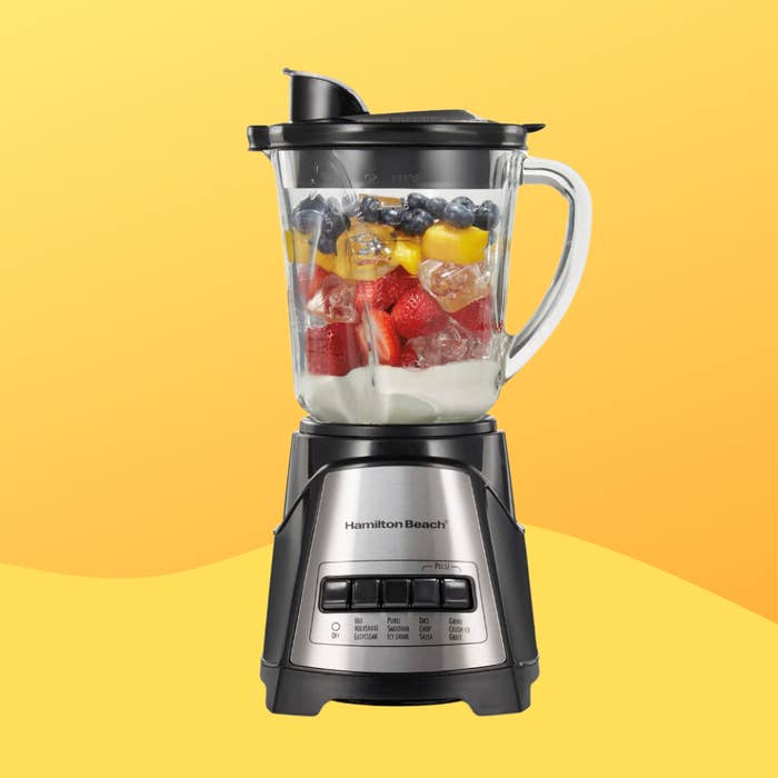 Blender filled with assorted fruits and crystal  connected  display, perfect  for smoothies. Featured successful  a buying  nonfiction  for room  appliances
