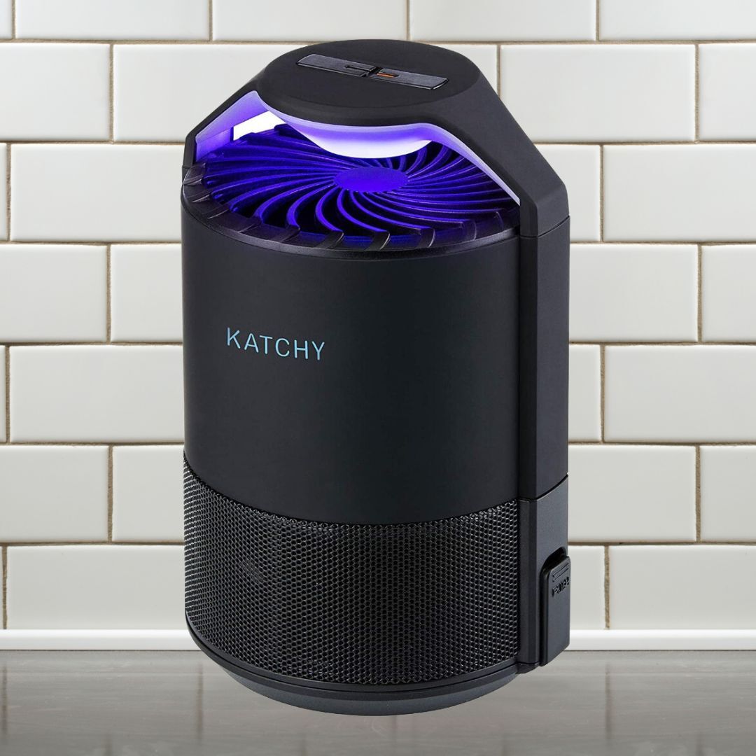 Katchy insect trap connected  a tiled surface, featuring sleek plan  with a apical  instrumentality   and power  panel, perfect  for efficiently managing indoor pests