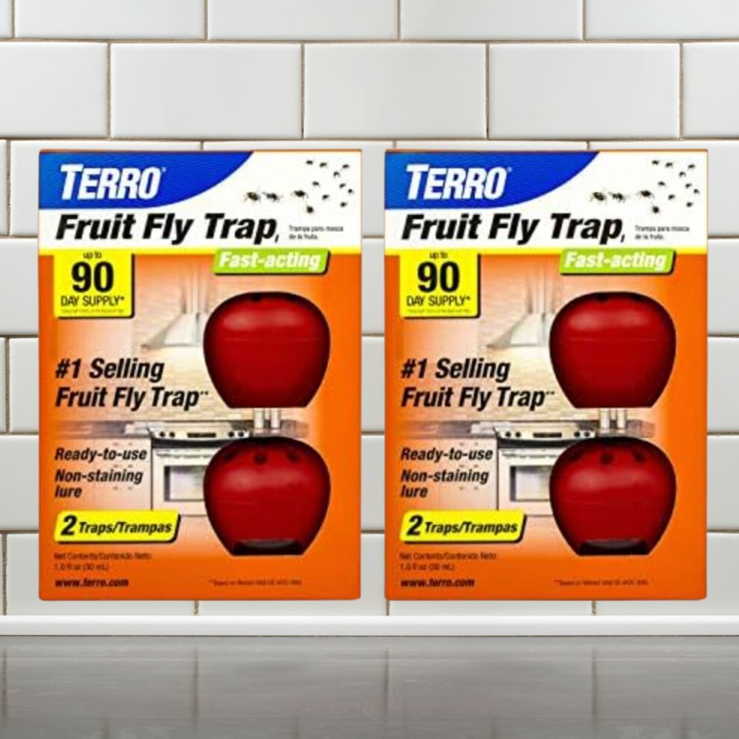 Two boxes of Terro Fruit Fly Traps with apples connected  the boxes, advertizing  a 90-day proviso   and non-staining lure
