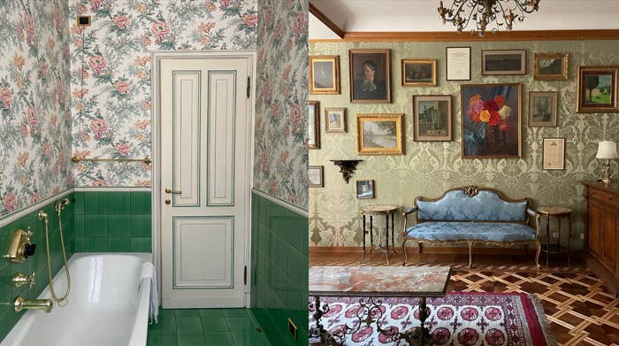 A luxurious bathroom with floral wallpaper and a green tiled bathtub next to a vintage-style living room with framed paintings and portraits on patterned walls