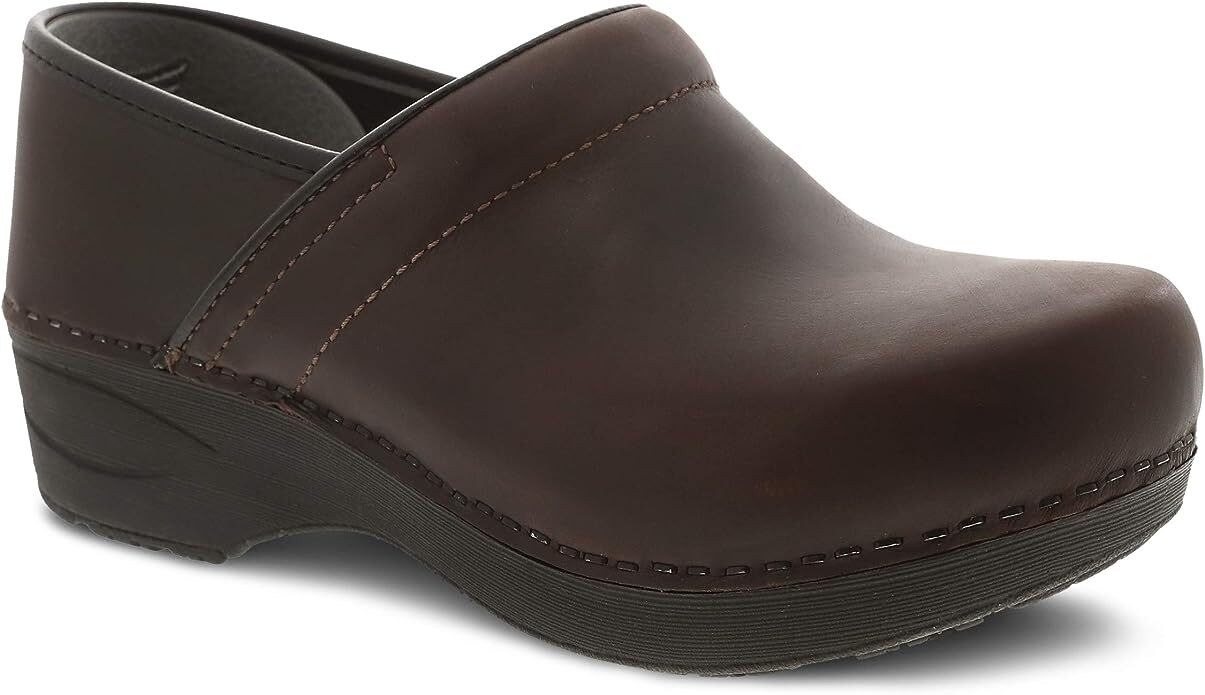 A single brown slip-on clog shoe with a slight heel and stitching detail