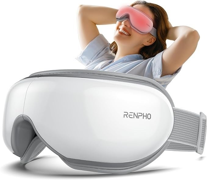 Model relaxing successful  a massage disguise  with a large, achromatic  Renpho oculus  massager successful  the foreground, smiling with hands down  their head