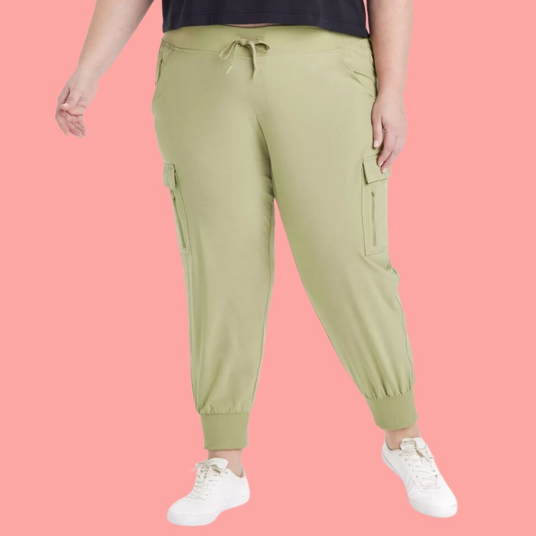 Person standing in a neutral pose wearing cargo khaki jogger pants and sneakers
