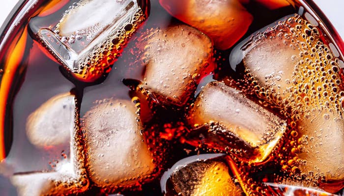Close-up of a carbonated beverage with ice cubes