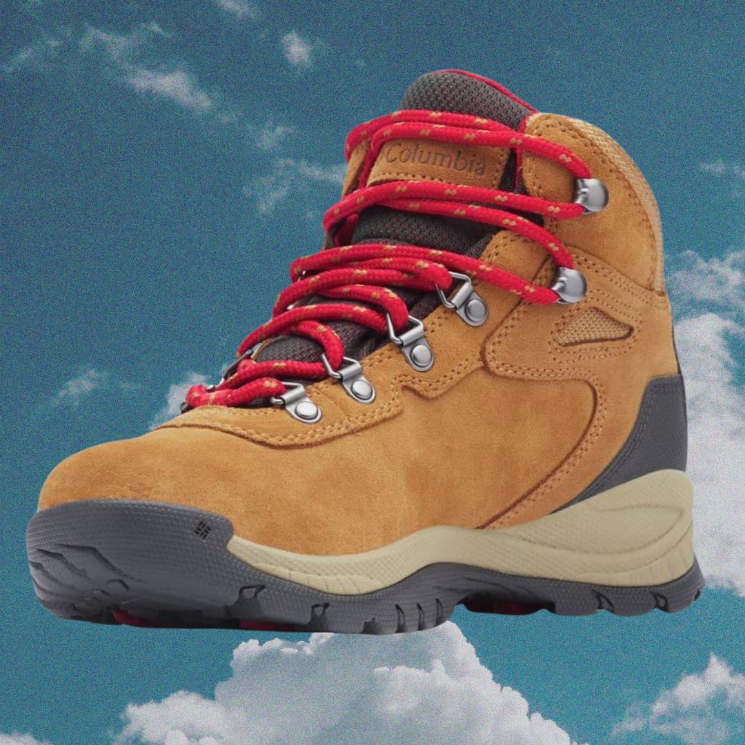 Close-up of a Columbia brand hiking boot against a cloudy sky background