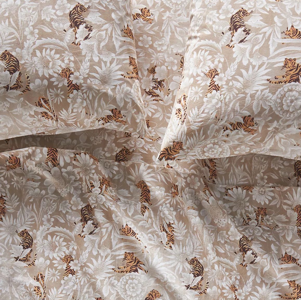 Close-up of a floral and tiger pattern sheets