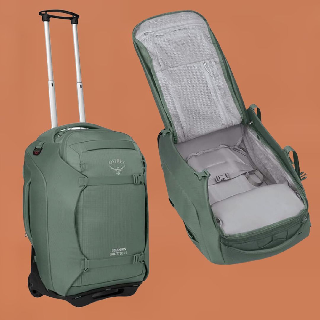A green rolling travel backpack open, displaying its storage compartments