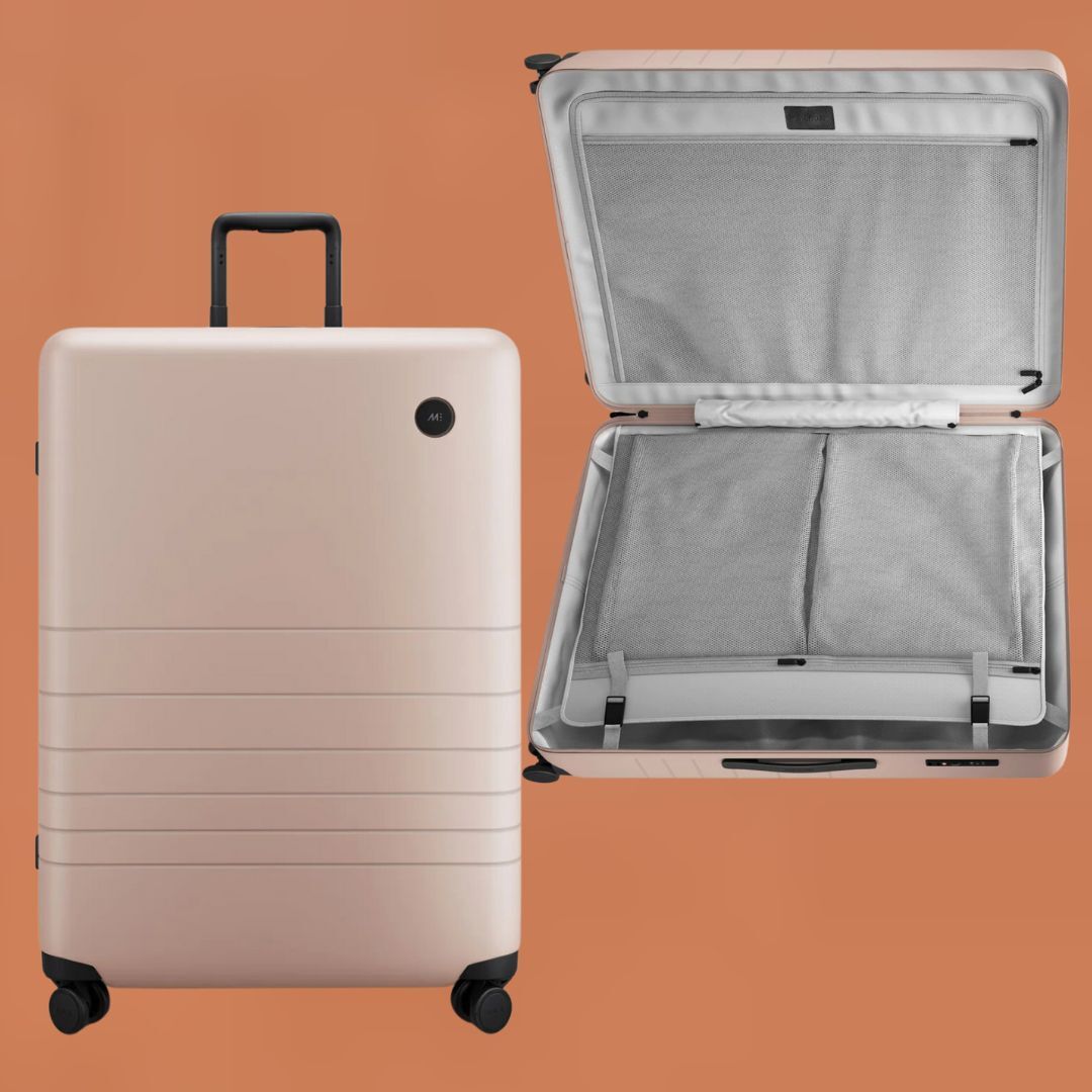 Two pieces of luggage, one closed upright suitcase and one open suitcase displaying interior