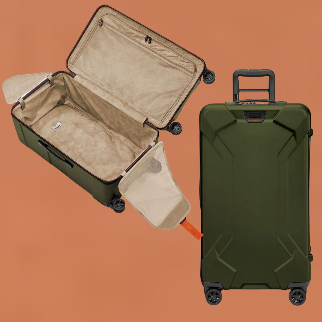 An open and a closed large green suitcase with wheels on an orange background