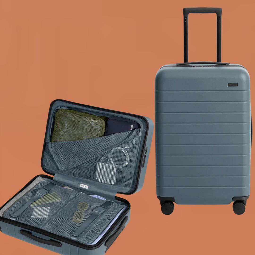 A hard-shell suitcase next to an identical open suitcase showing organized compartments