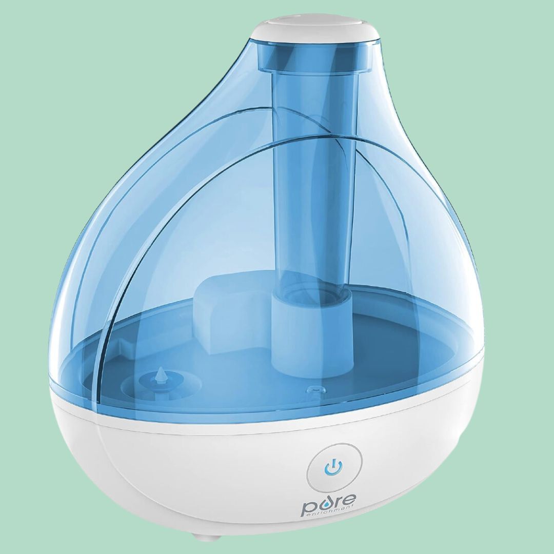 Cool mist humidifier with a teardrop shape, transparent top, and power button, perfect for location usage to adhd moisture to the air