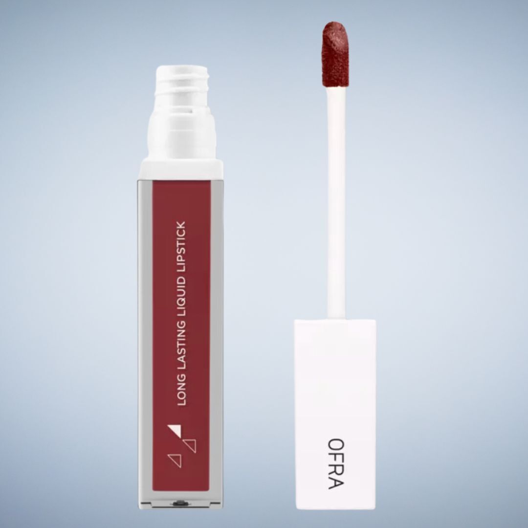 Bottle of OFRA long-lasting liquid lipstick with applicator beside it