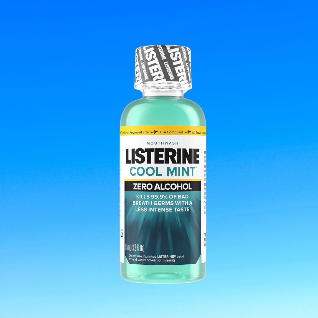 Listerine Cool Mint mouthwash bottle against a blue background