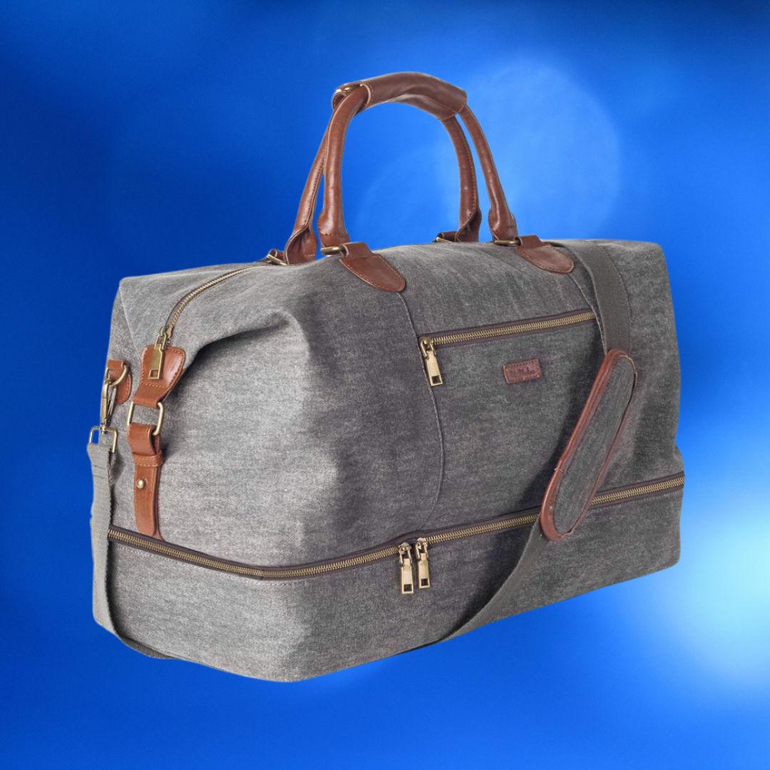 Gray canvas travel bag with brown leather handles and trim, floating against a blue background
