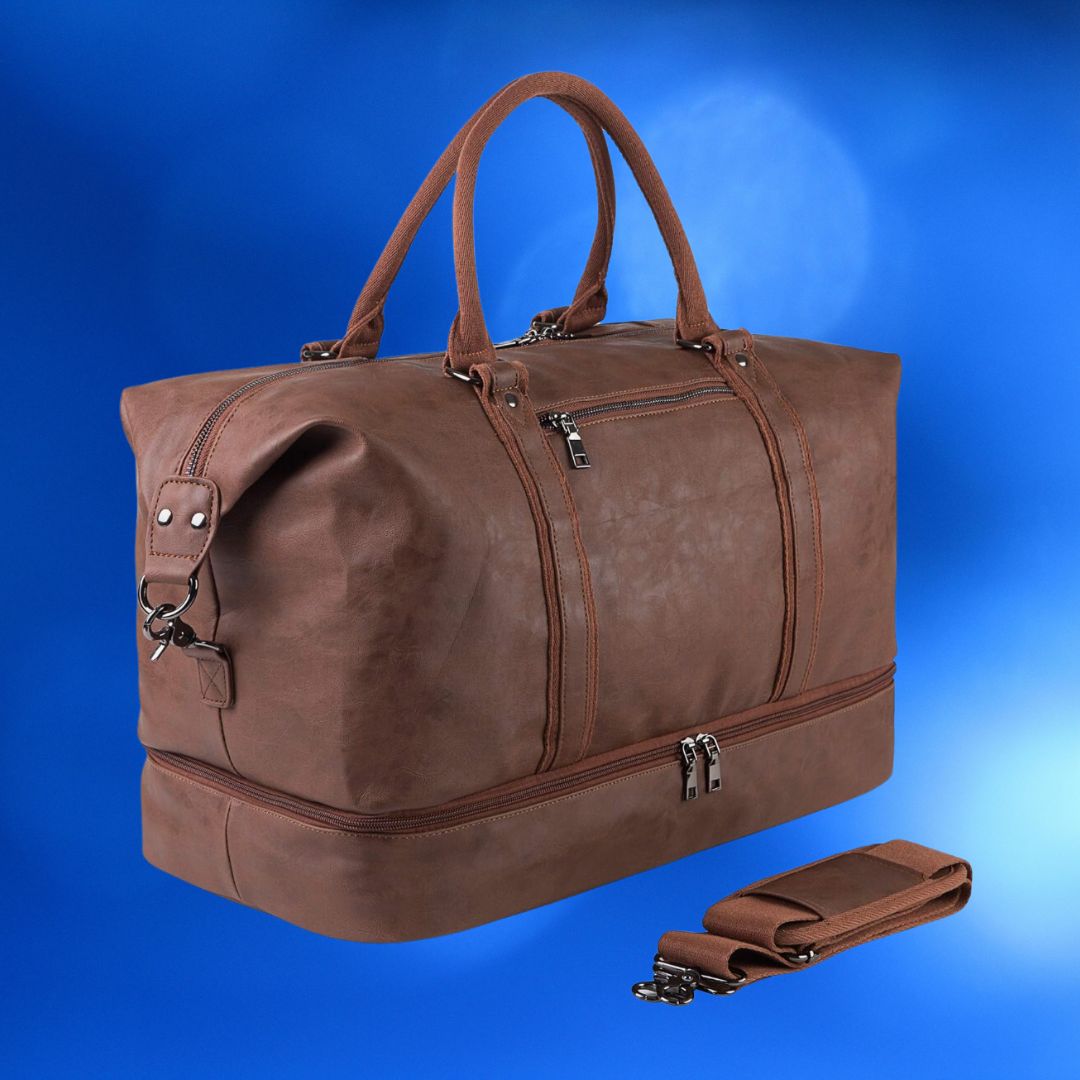 Leather duffle bag with dual handles, exterior pockets, and a detachable shoulder strap against a blue background