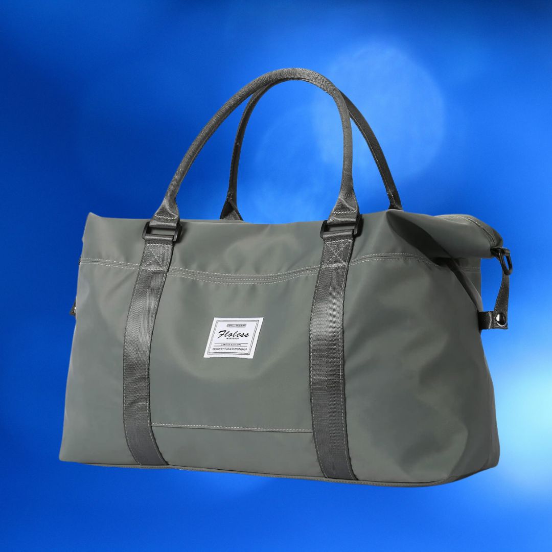 Olive green tote bag with a brand label, dual handles, and a shoulder strap against a blue background
