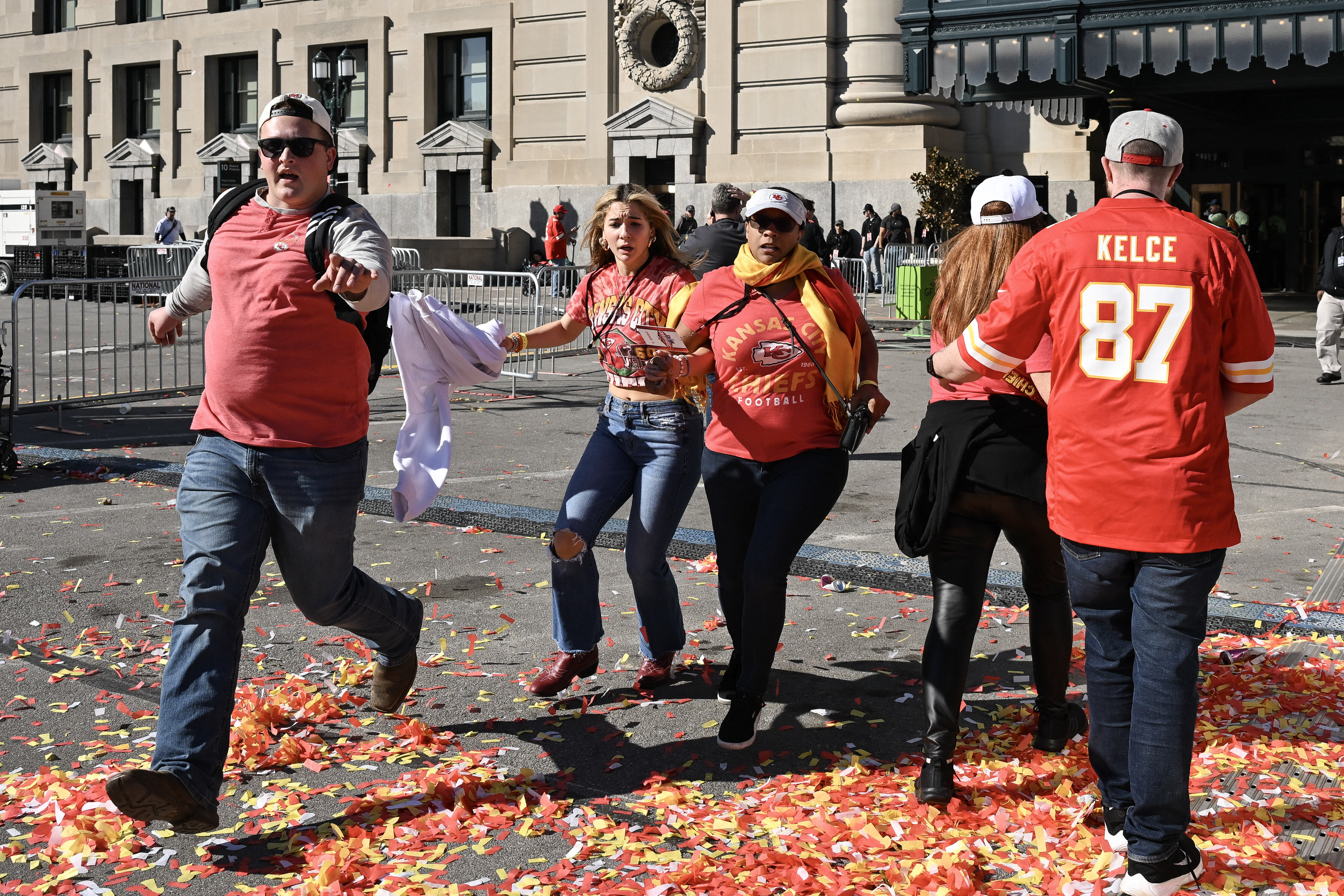 People flee after shots were fired near the Kansas City Chiefs&#x27; Super Bowl LVIII victory parade on Wednesday in Kansas City, Missouri.