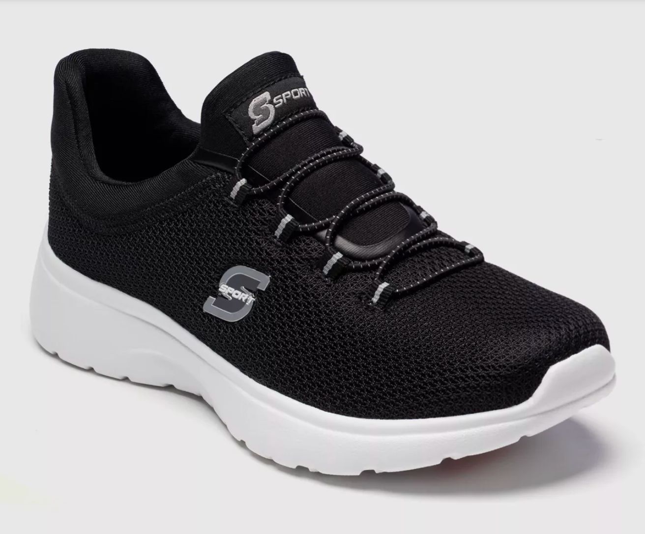 A black and white Sketchers sneaker