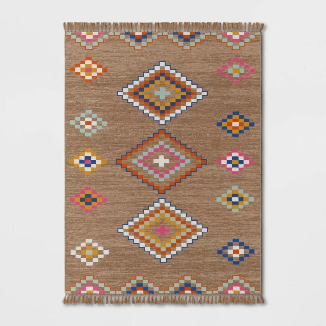 A brown and multicolored rug with a southwest design
