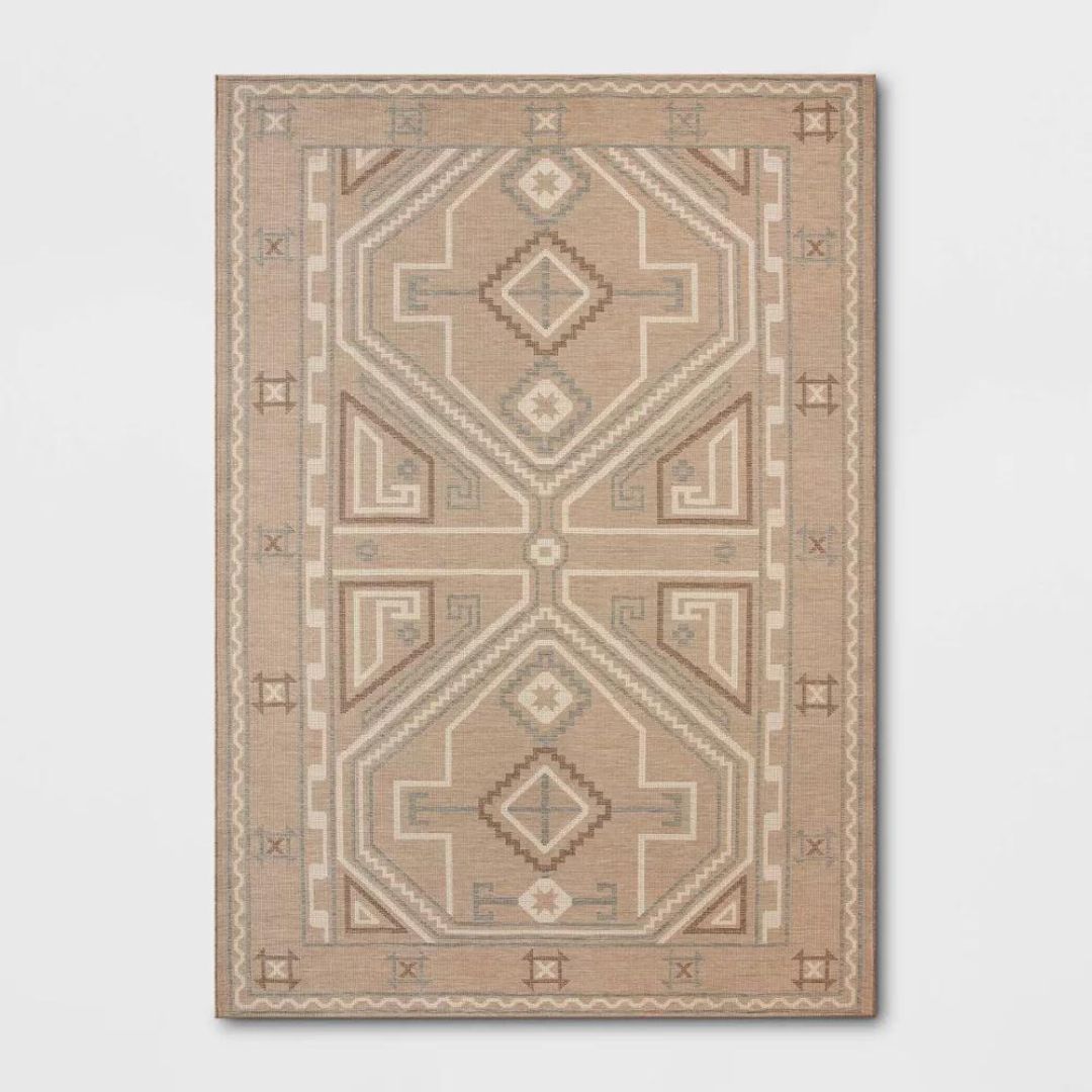A beige, cream, and brown rug with a modern Persian design