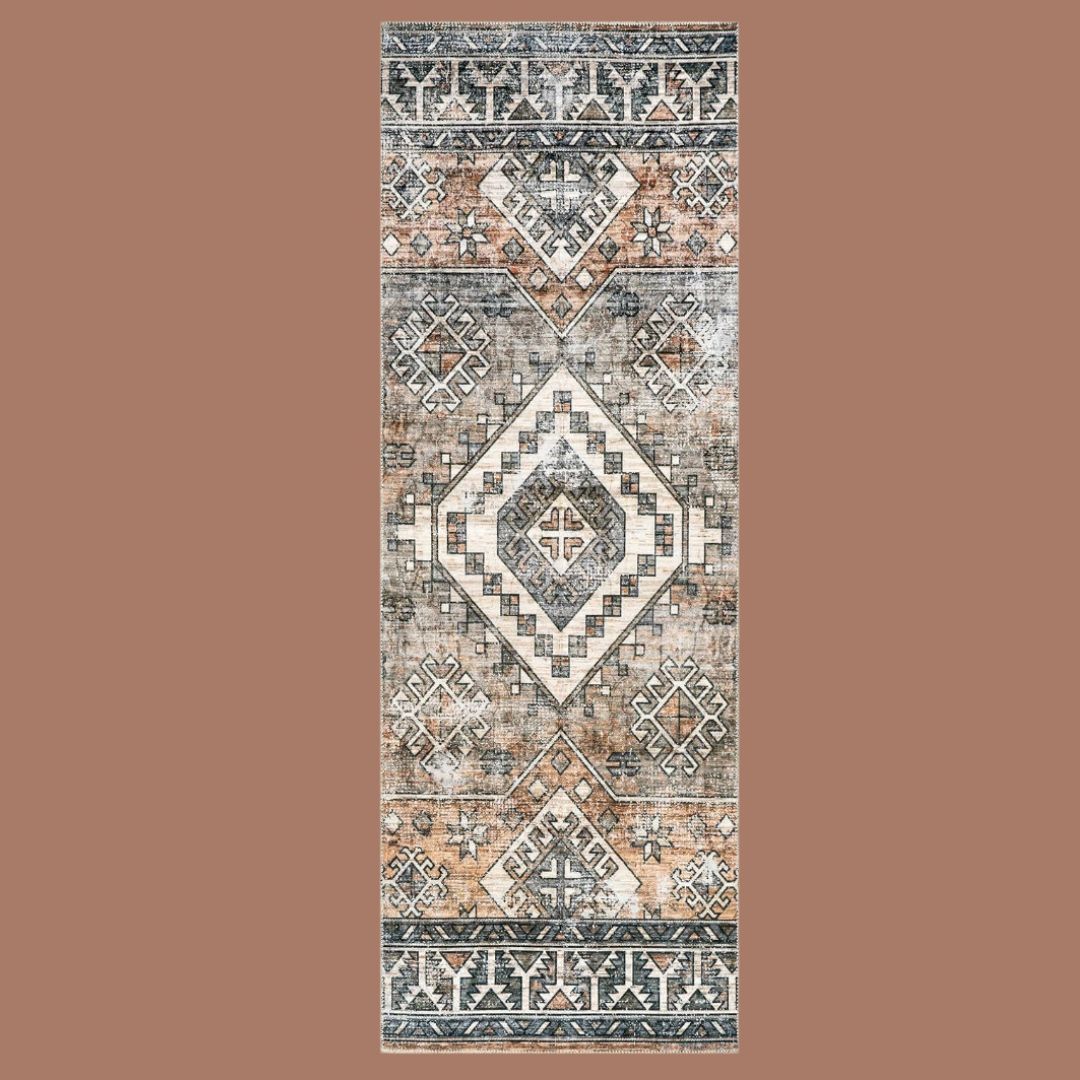 A faded, vintage pattern rug on a beige background
