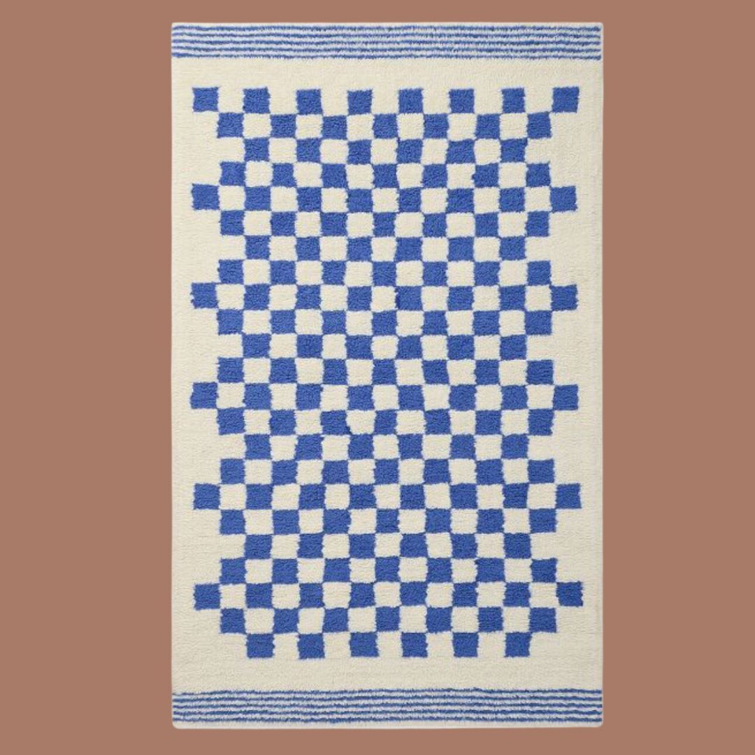 A blue and white checkered rug on a beige background