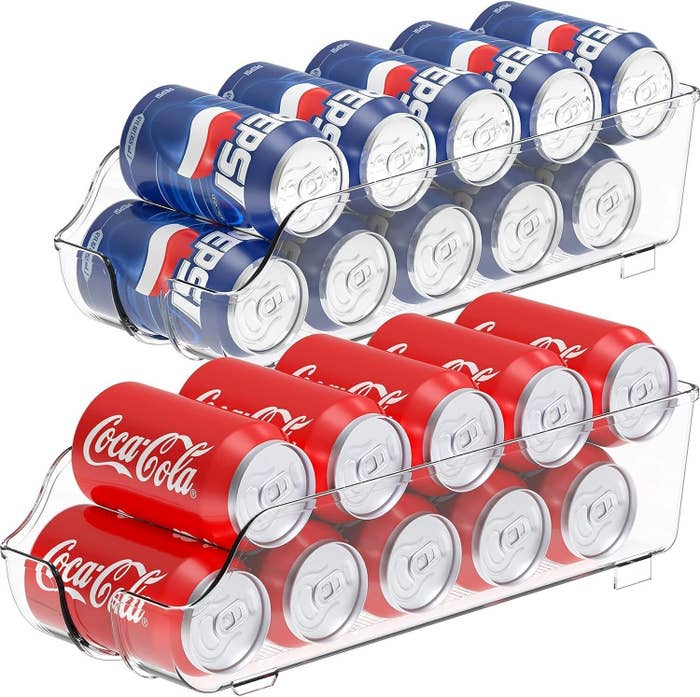 A stackable fridge organizer holds Pepsi and Coca-Cola cans, showcasing organized retention  options for drinks