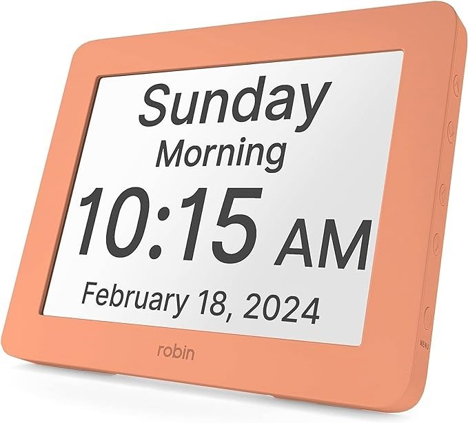A digital clock with a large, flat-screen display showing the hour, day of the week, time of day, and date