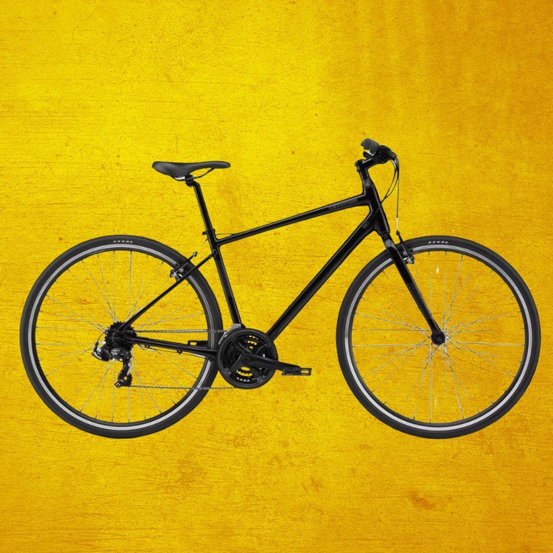 Sepeda hitam dengan latar belakang kuning