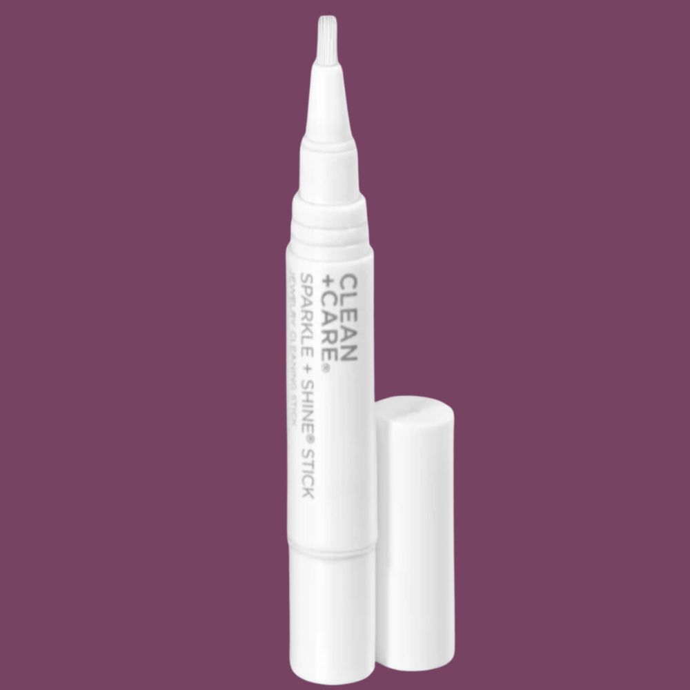 A Clean and Care Sparkle and Shine stick, uncapped, for cleaning jewelry