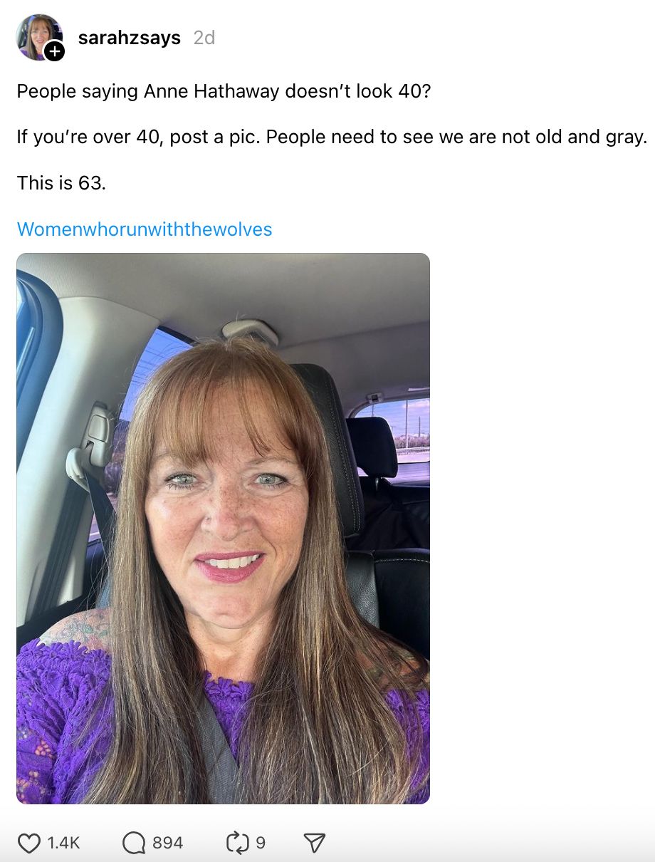 Sarahzsays' post: &quot;People saying Anne Hathaway doesn’t look 40? This is 63.&quot; Includes photo of Sarahzsays with long hair, purple lace top, smiling in a car