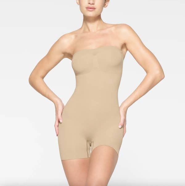 Model wearing the clay bodysuit