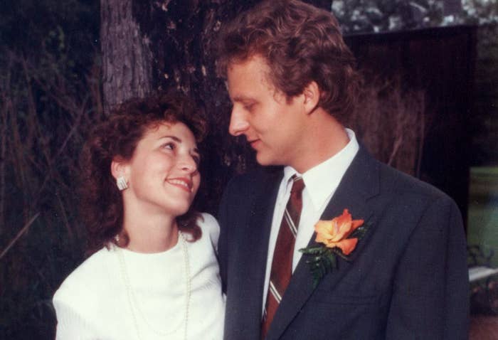 The author and his wife look at each other lovinigly on their wedding day
