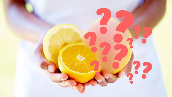Close-up of hands holding sliced citrus fruits, including an orange and a lemon, with question marks digitally added over the fruits