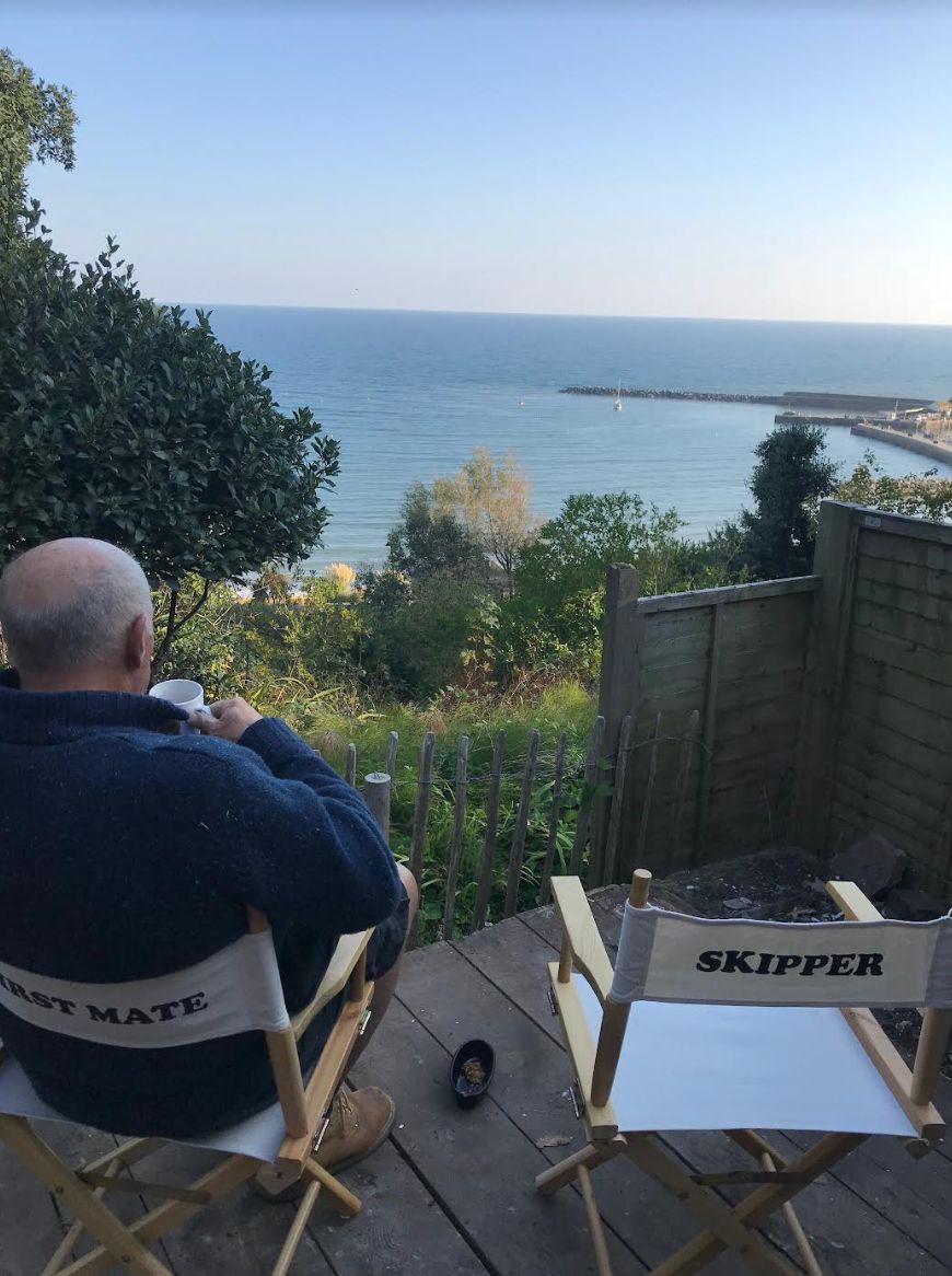 Simon having tea at the edge of our garden in 2018