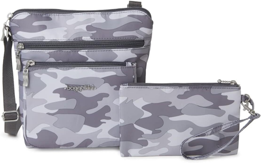 Three Baggalini bags with a gray camouflage pattern, displayed for shopping. The set includes a crossbody bag, a small pouch, and a wristlet