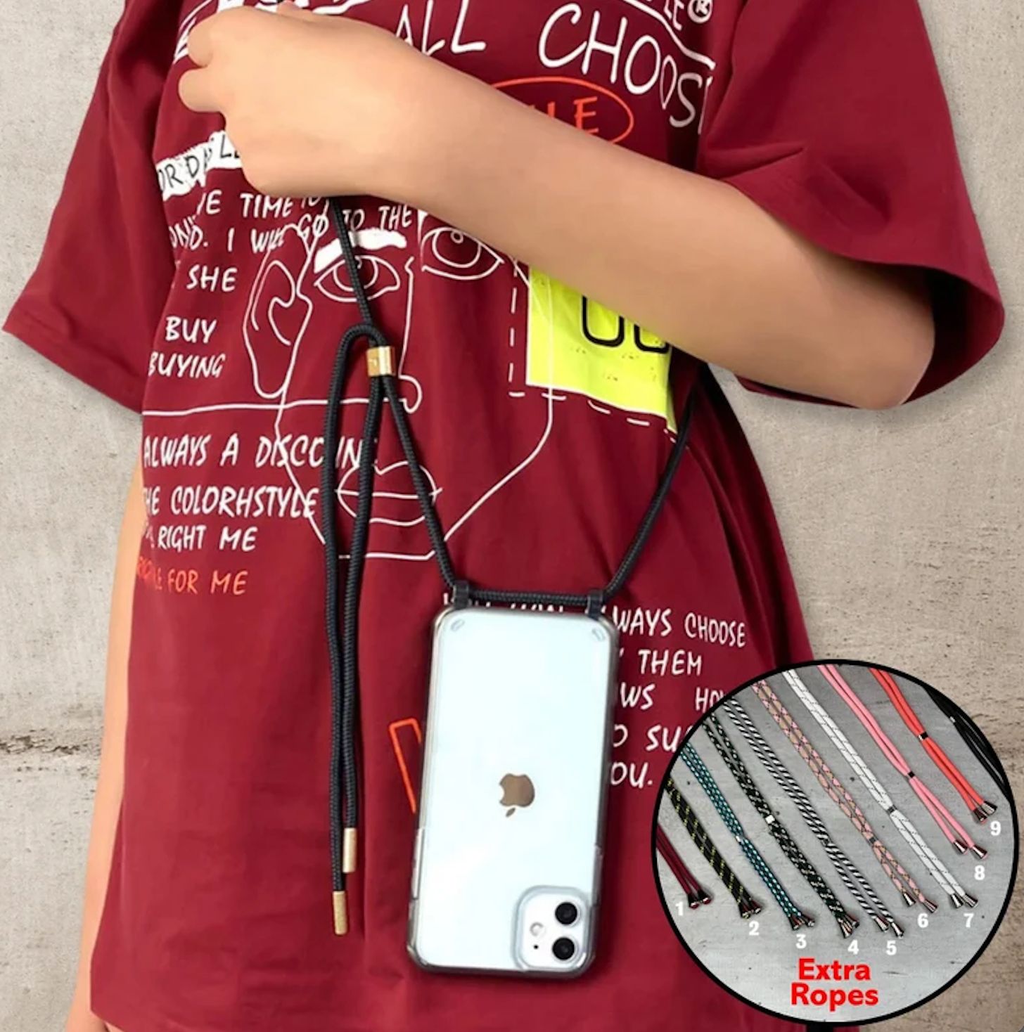 Person wearing a graphic t-shirt uses a black cord to suspend an iPhone around their neck. Inset image shows various styles of extra ropes available