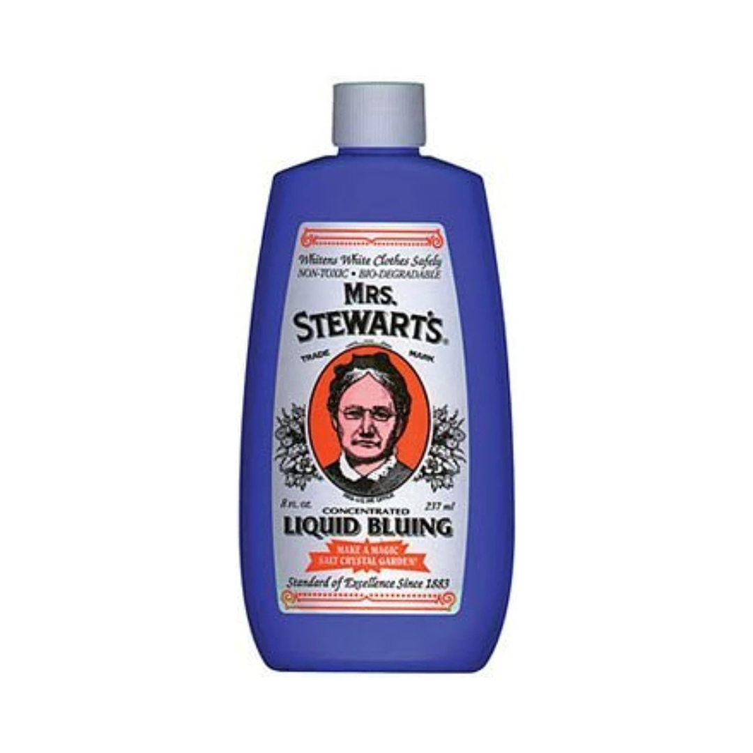 Bottle of Mrs. Stewart's Concentrated Liquid Bluing with a vintage statement   featuring a woman's portrait. Used for laundry whitening